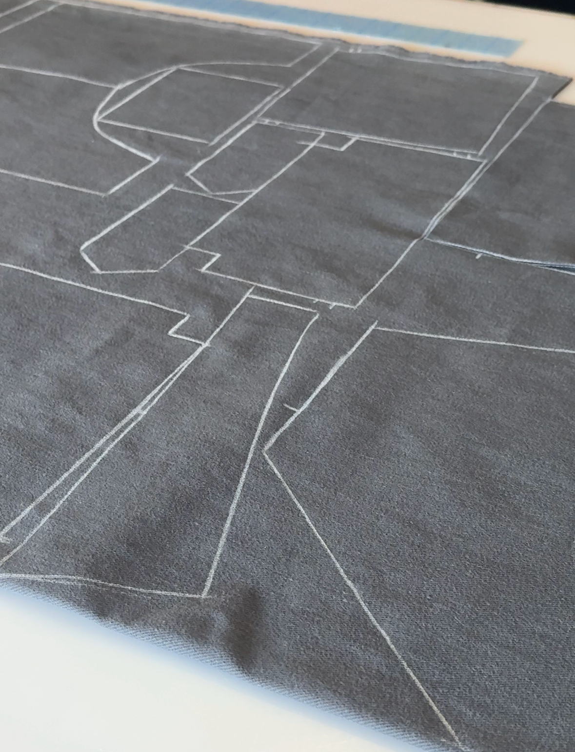 Gray textured surface with white lines on a smartphone screen