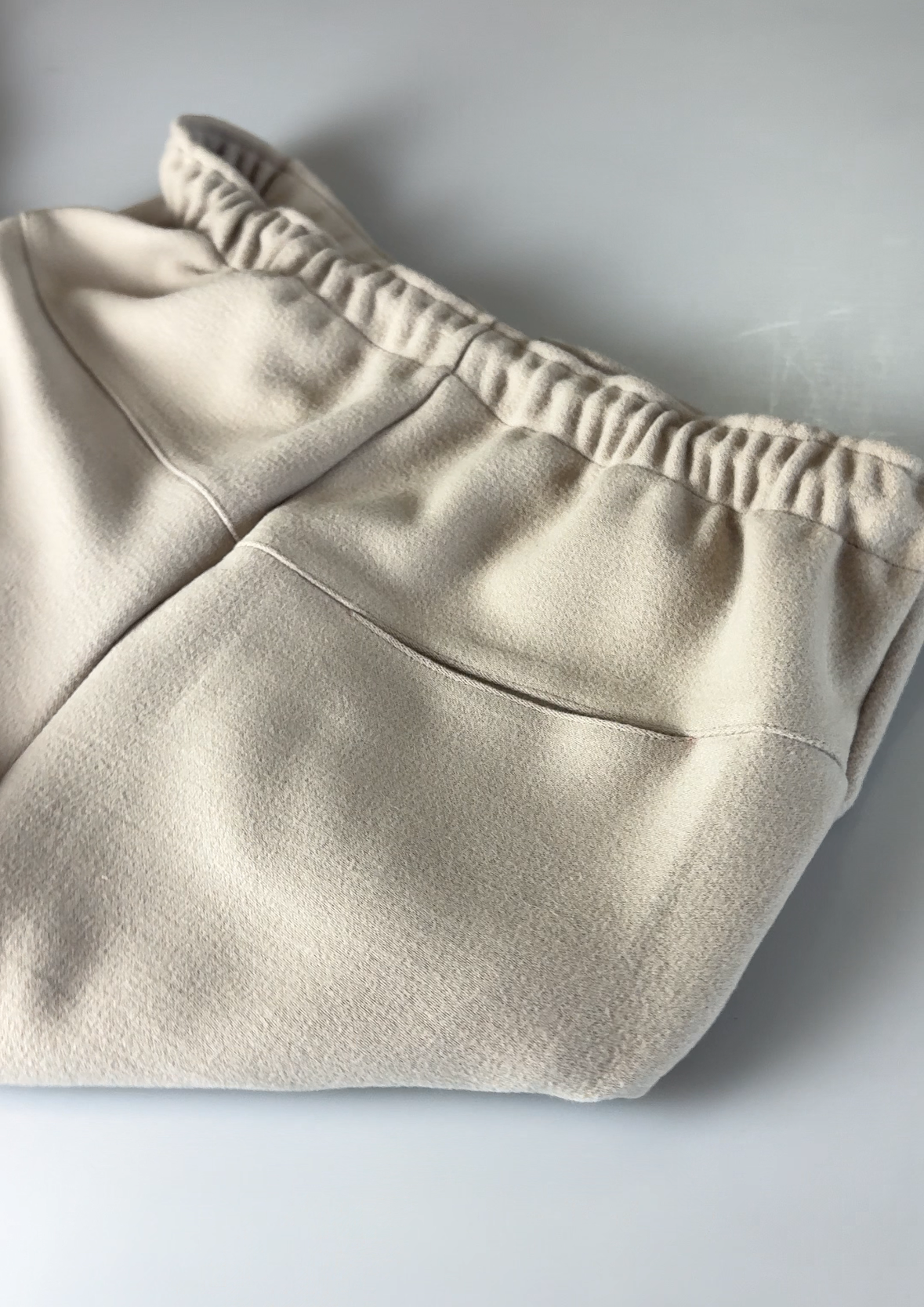 Beige shorts on a light gray background